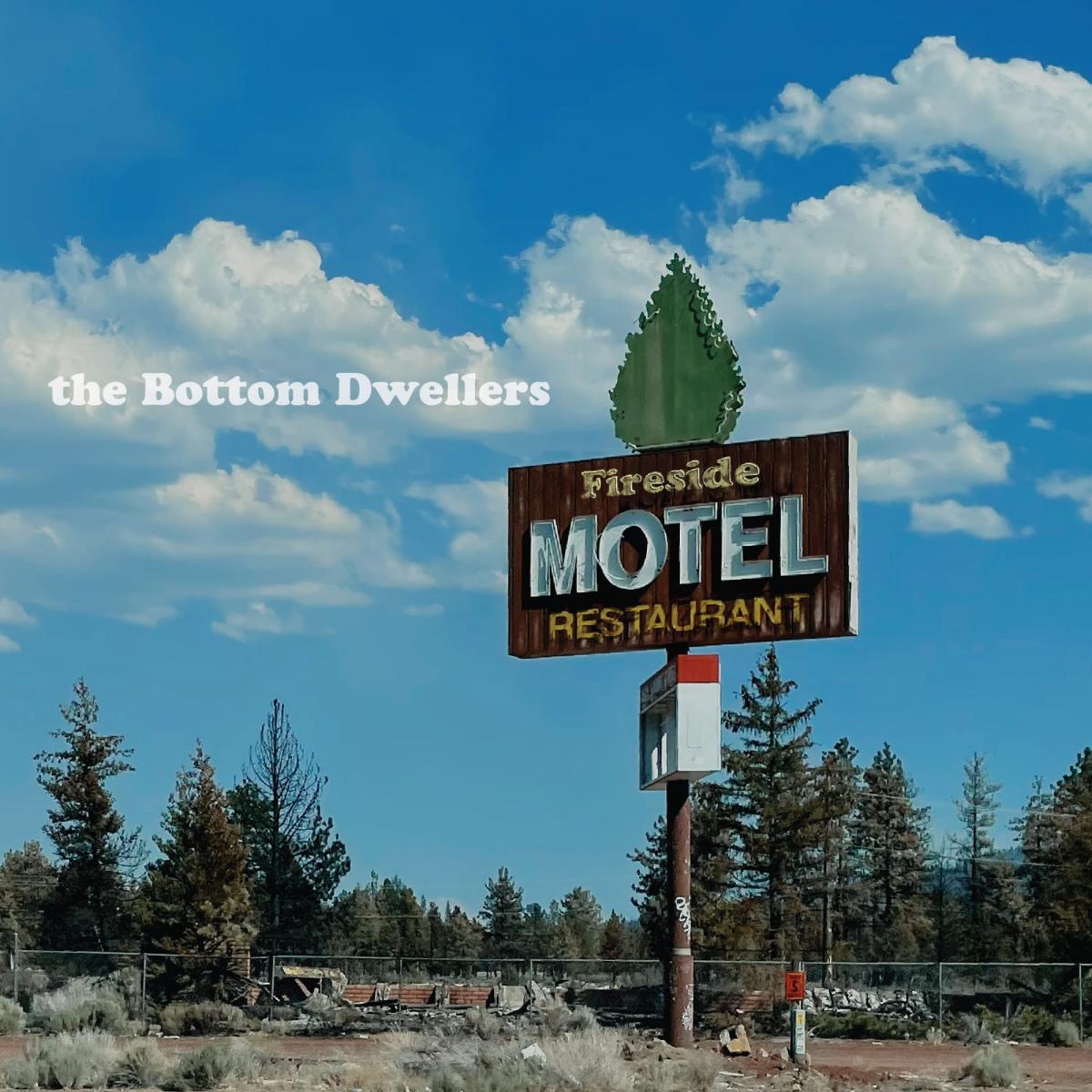 Fireside album cover by the Bottom Dwellers featuring a burned down abandoned hotel