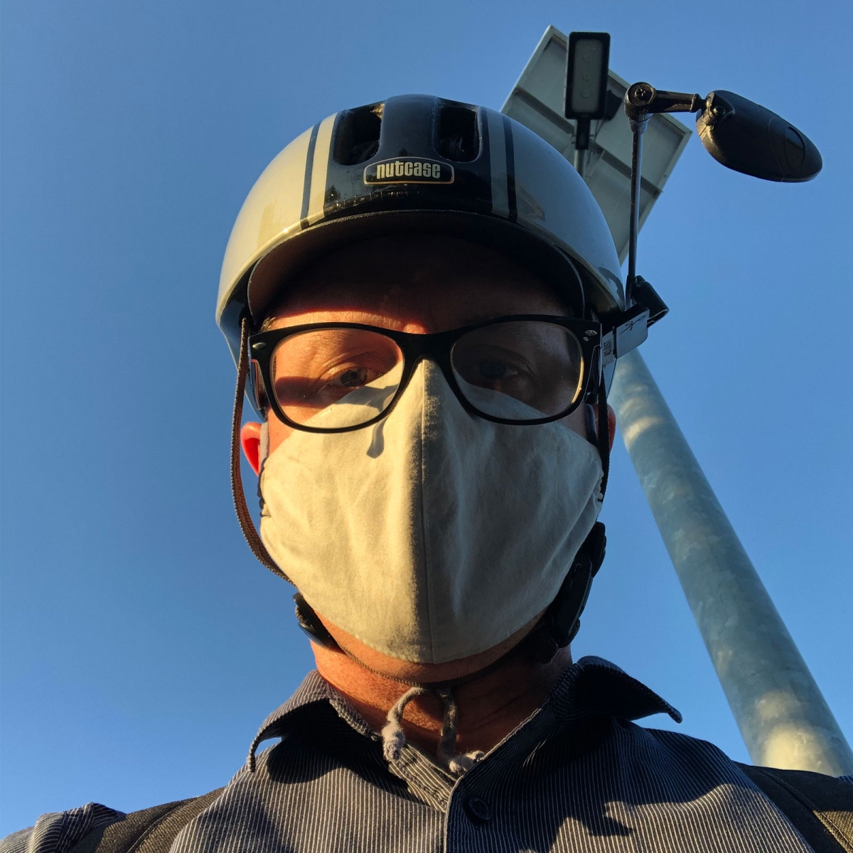 Selfie in commute mask and bike helmet