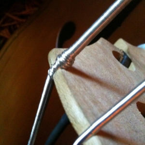 Bass string winding bound up at bridge