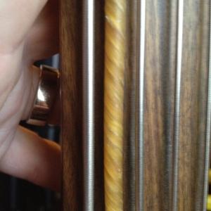 Side by side comparison of steel and gut double bass strings
