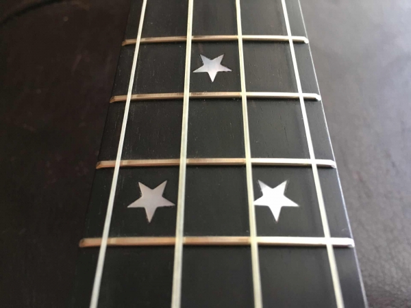 Ukulele fret board with star inlays